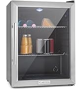 avec porte vitrée, cadre en acier inoxydable. Deux étagères visibles, stockant des boissons et des produits alimentaires. Lumière LED intérieure éclairant le contenu