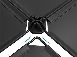 Gros plan d'un coin de drap de lit noir doté d'un système de clips en forme de X et de supports angulaires blancs pour fixer les draps aux coins du matelas