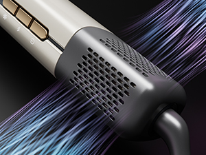 Gros plan d'un outil de coiffure à finition métallique, doté de grilles de ventilation et d'effets de visualisation du flux d'air