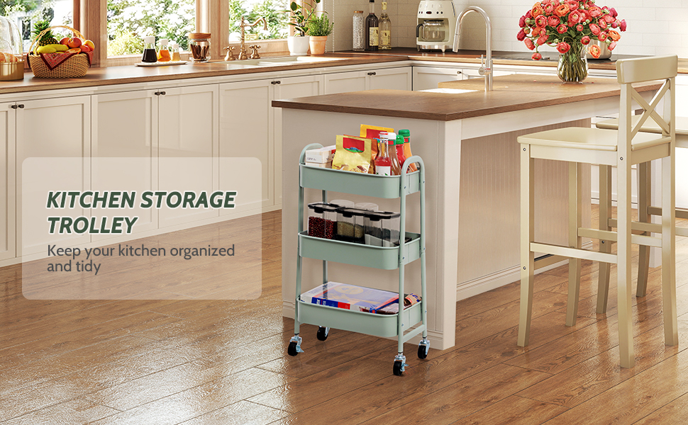 Chariot de rangement de cuisine à trois niveaux sur roulettes, couleur bleu clair, représenté dans un décor de cuisine. Dispose de plusieurs compartiments de rangement pour organiser divers articles et fournitures de cuisine.