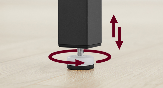 Appareil cylindrique noir avec base circulaire rouge. La flèche indique un mouvement vertical. Peut-être un support réglable ou un système de montage.