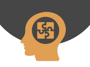 Icône stylisée d'une tête humaine de profil avec un cerveau en forme de pièce de puzzle, coloré en orange et gris foncé