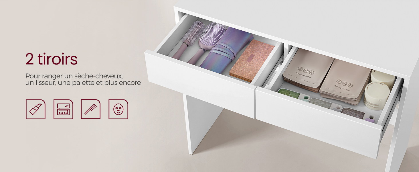 un tiroir blanc contenant un livre, un carnet et d'autres objets.