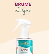 Flacon pulvérisateur turquoise et blanc étiqueté « Brume Légère », orné d'un motif décoratif