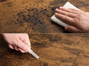 Essuyer la surface en bois à la main avec un chiffon pendant que l'autre main utilise un tournevis pour retirer les petites vis éparpillées sur la surface en bois