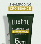 Le texte indique « SHAMPOOING CROISSANCE ». Démonstration du produit montrant l'application d'un flacon pulvérisateur sur des plants de lavande violette ou une végétation similaire.