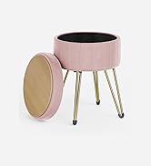 une jardinière rose avec un cadre en métal noir et une base dorée.