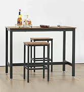 une table de bar avec deux tabourets et un tabouret de bar